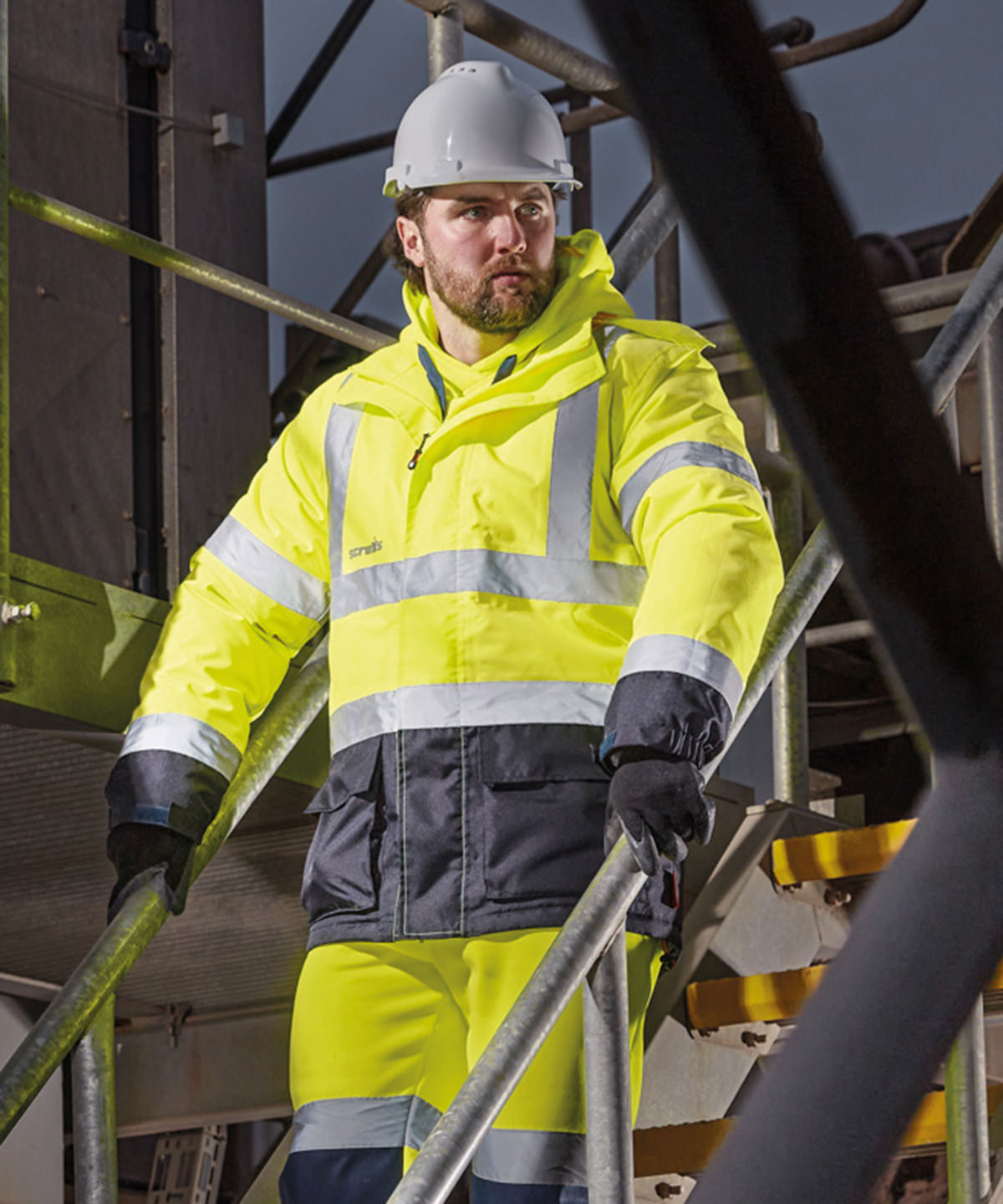 High-visibility waterproof jacket worn